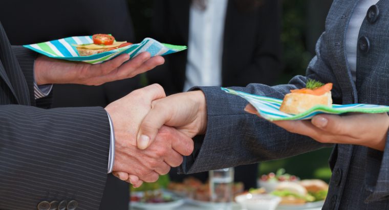 Business handshake during lunch